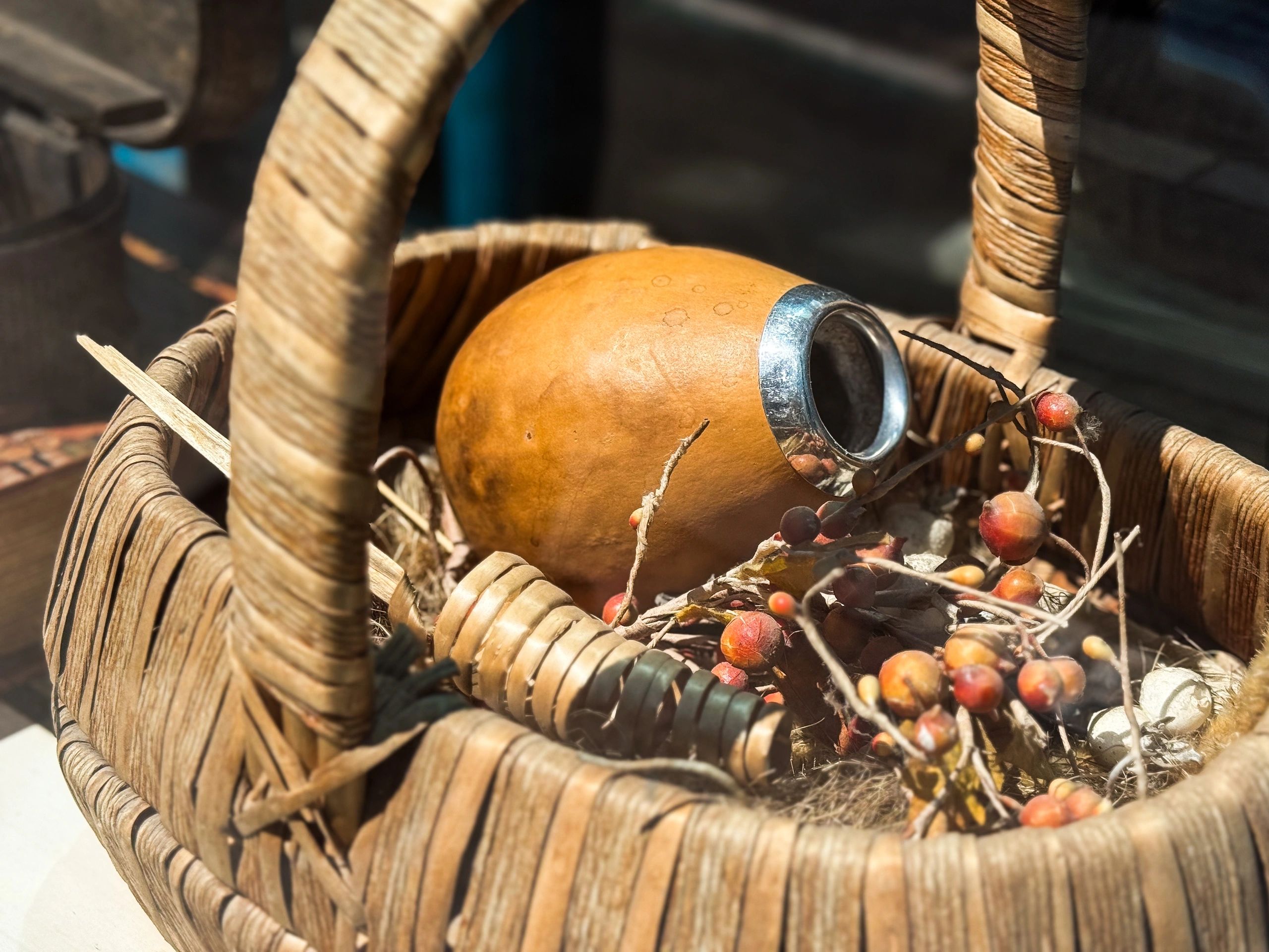 Close-up of a calabash drinking vessel in a woven basket